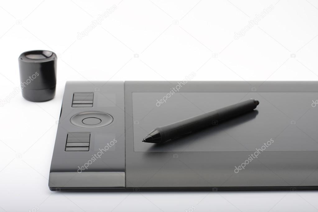 graphic tablet and pen and stand for nibs on white background