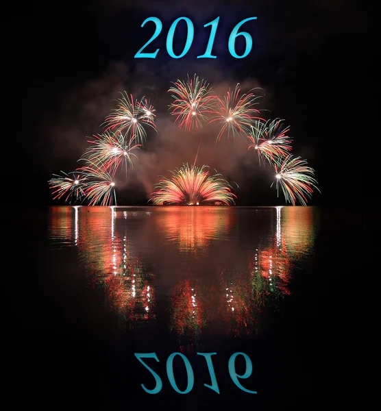 Colorful fireworks with reflection on lake with text 2016 — Stock Photo, Image