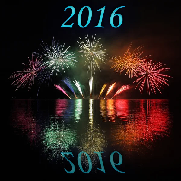 Colorful fireworks with reflection on lake with text 2016 — Stock Photo, Image