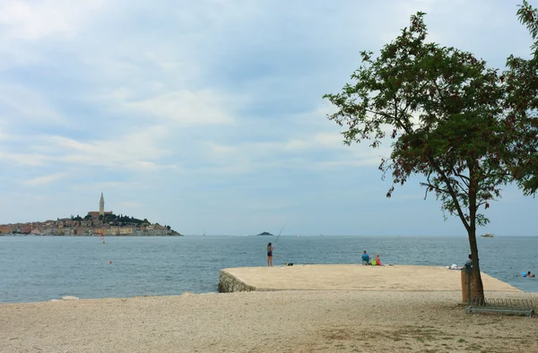 Town beach in cloudy day in Rovinj in Croatia — Stock Photo, Image