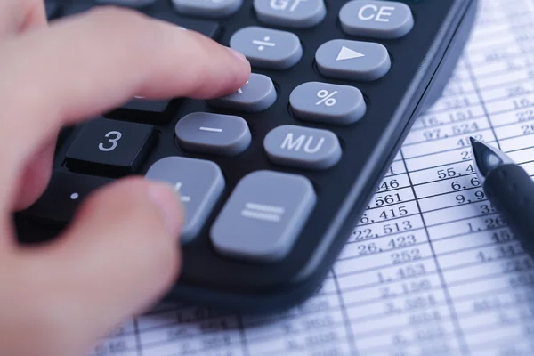 Calculator And Pen On Sheet — Stock Photo, Image