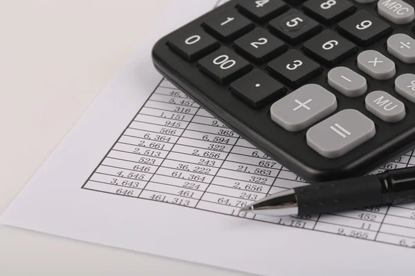 Calculator And Pen On Sheet — Stock Photo, Image