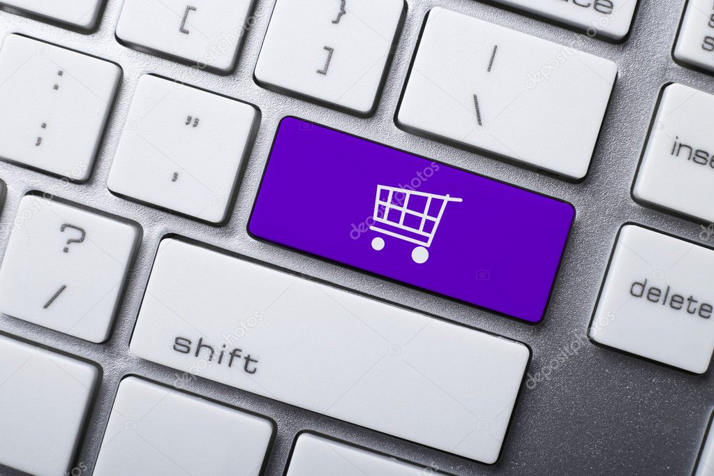 Online shopping or internet shop concepts, with shopping cart symbol on the keyboard.