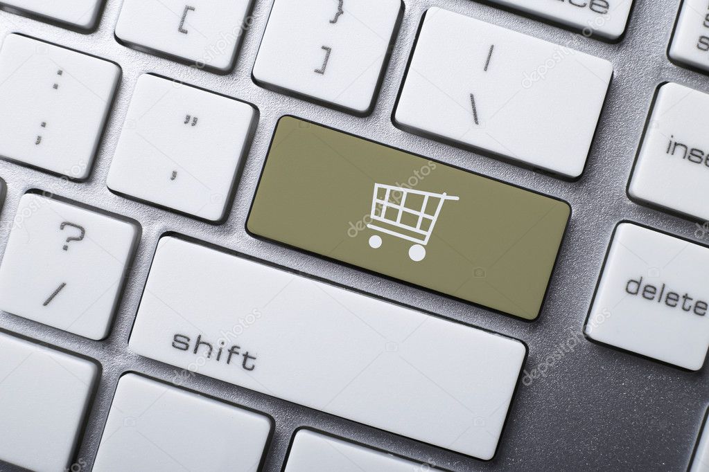 Online shopping or internet shop concepts, with shopping cart symbol on the keyboard.