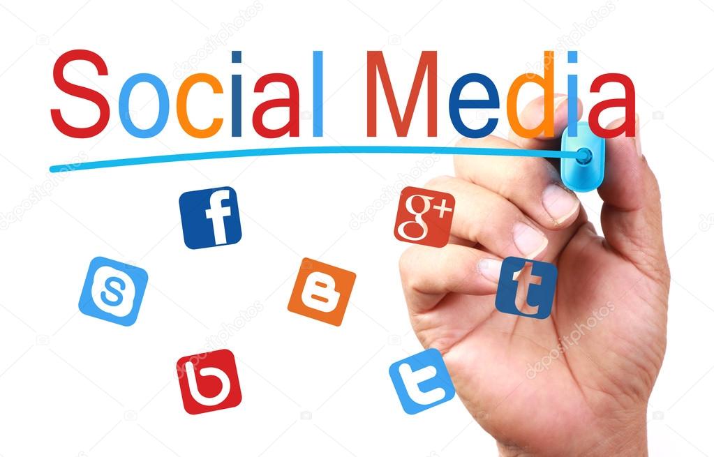 Hand with blue marker writing social media concept on transparent white board.