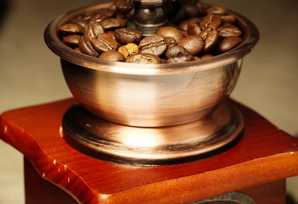 Closeup coffee bean and coffee grinder — Stock Photo, Image