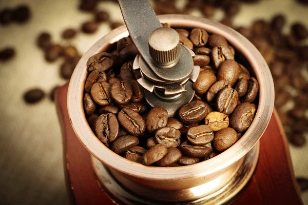 Closeup coffee bean and coffee grinder — Stock Photo, Image