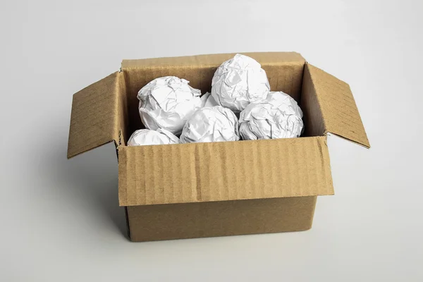 Pelota de papel en caja — Foto de Stock