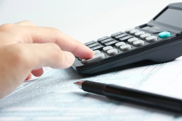 Working with a calculator — Stock Photo, Image