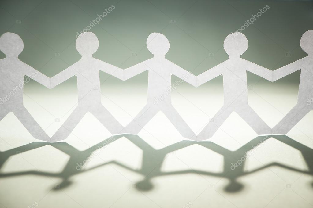 Group of people holding hands