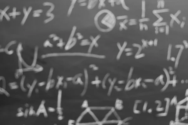 Maths formulas on chalkboard bokeh — Stock Photo, Image