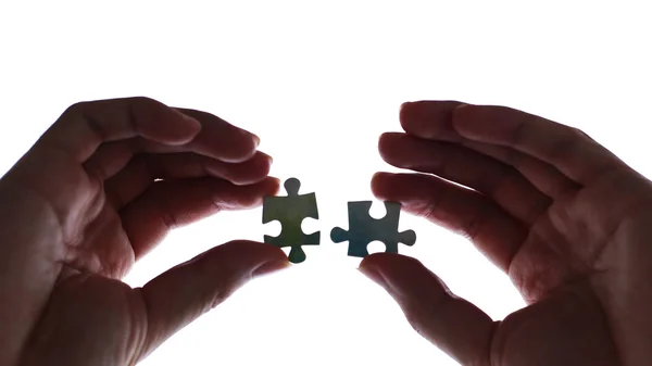 Hands Holding Puzzle Stock Picture