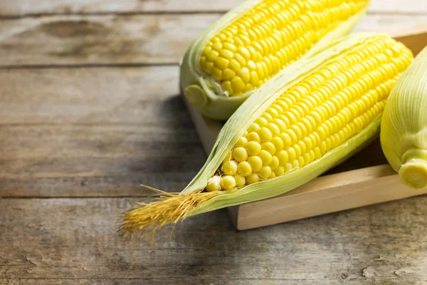 Fresh corn on wooden table — Stock Photo, Image