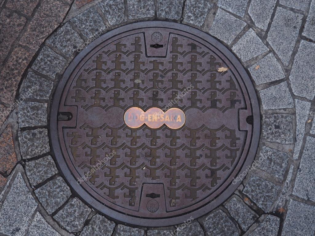 Manhole drain cover on the street at Shibuya, Tokyo, Japan. — Stock