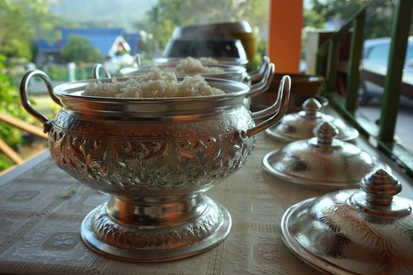 Rice offerings in a Buddhist monk's alms bowl — Stock Photo, Image