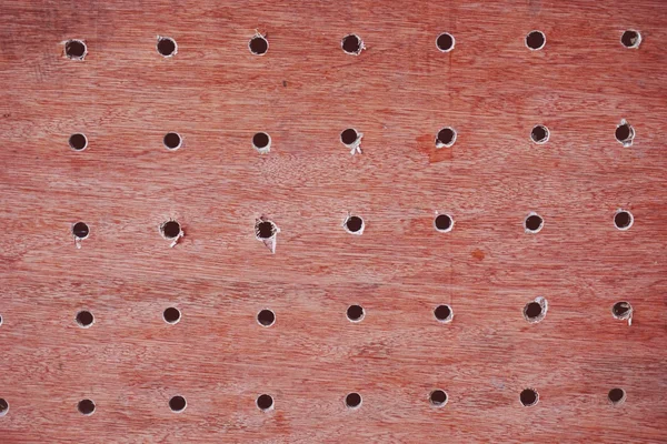 กระดานไม้ที่มีรูเจาะ — ภาพถ่ายสต็อก