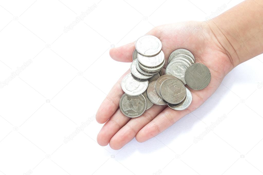 Hands of children and coins