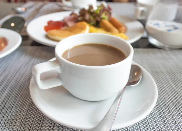 Coffee cup and saucer on table — Stock Photo, Image