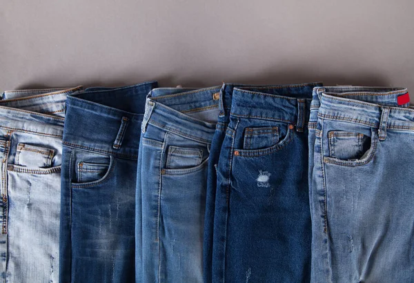 Mode Olika Jeans Grå Bakgrund — Stockfoto