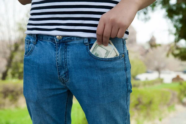 Man Putting Money Pocket Jeans — Stock Photo, Image