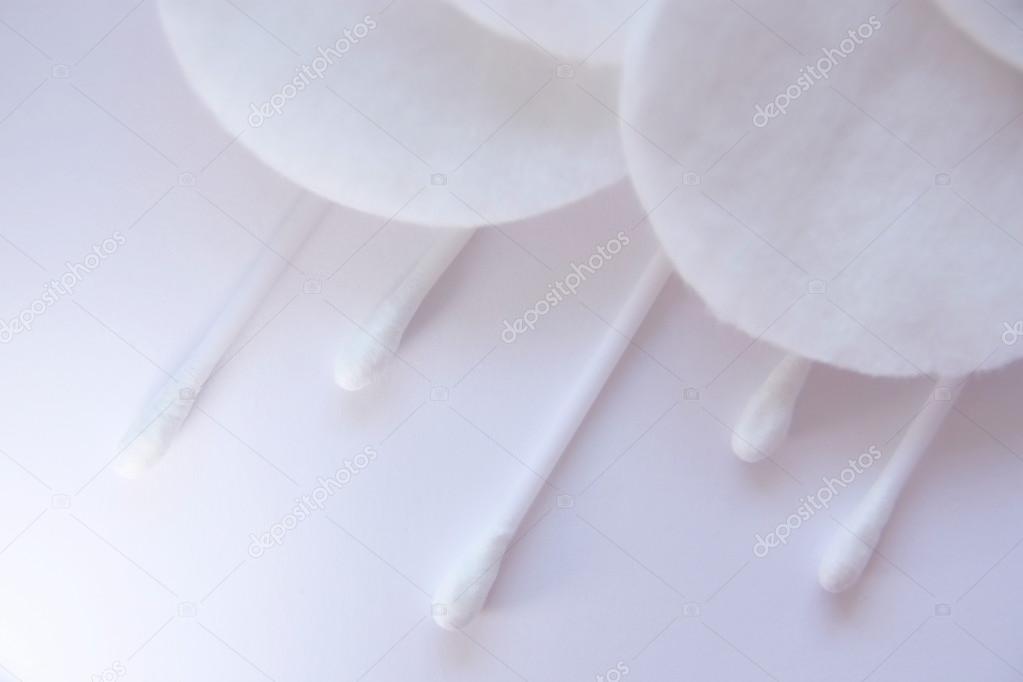 Cloud with rain of cotton swabs and cotton pad. high key