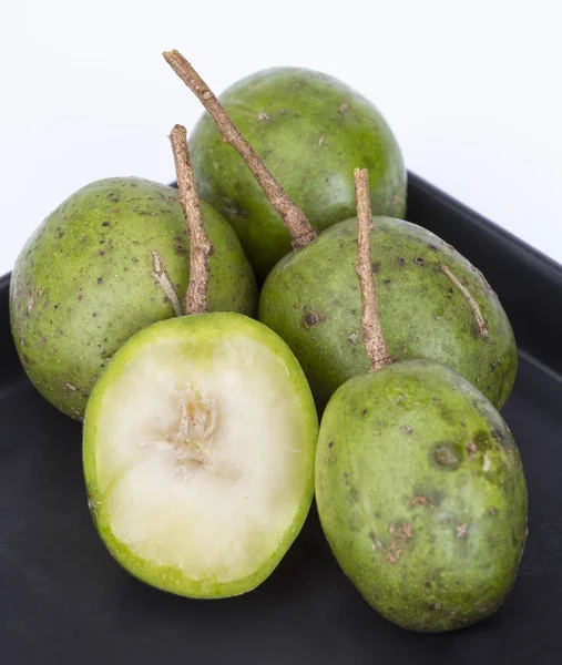 Fresh Hog plum (Wild Mango) on black dish — Stock Photo, Image