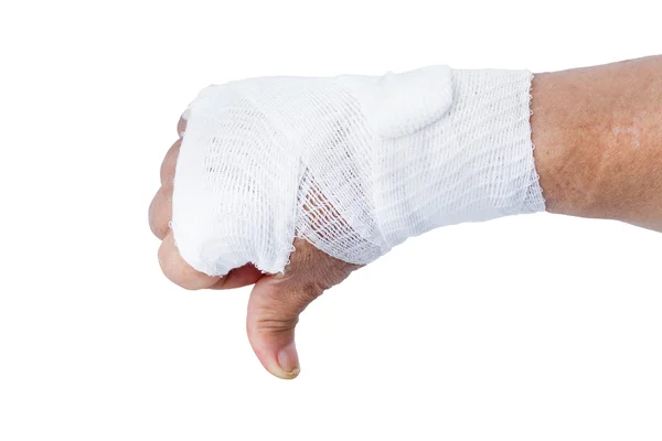Tummen ner visar för hand med vitt bandage isolerade — Stockfoto