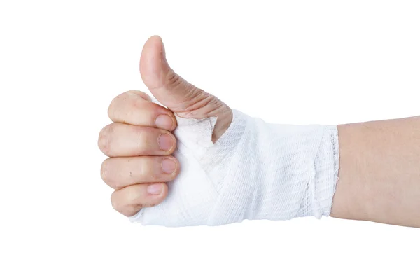 Tummen upp för hand visar med vitt bandage isolerade på vit — Stockfoto