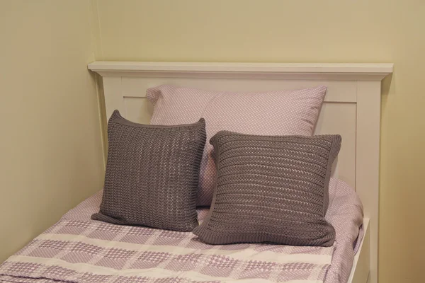 Comfortable beige cushions on the bed. Interior — Stock Photo, Image