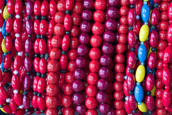 Beautiful beads hang on the counter. backgrounds — Stock Photo, Image