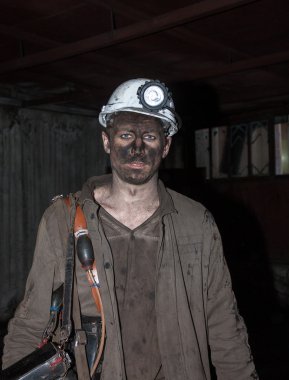 Donetsk, Ukraine - November, 06, 2012: The miners in the mine na clipart