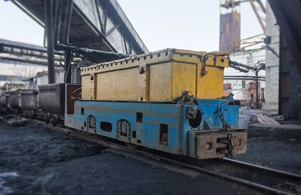 Train in national colors with trolleys in a coal mine. Donbass, — Stock Photo, Image