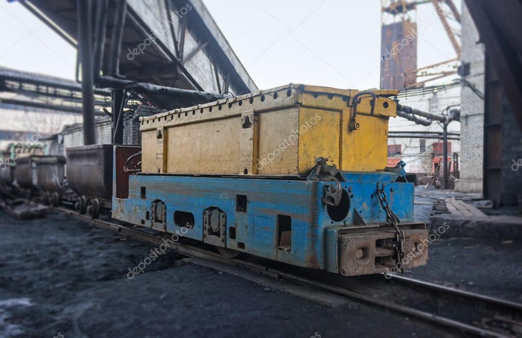 Train in national colors with trolleys in a coal mine. Donbass,