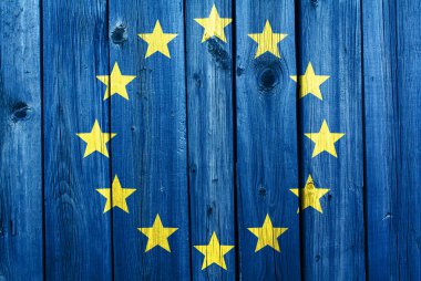 European Union flag in the background of an old cracked wooden t