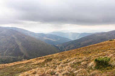 Mountain panoramic landscape in cloudy weather. Carpathians
