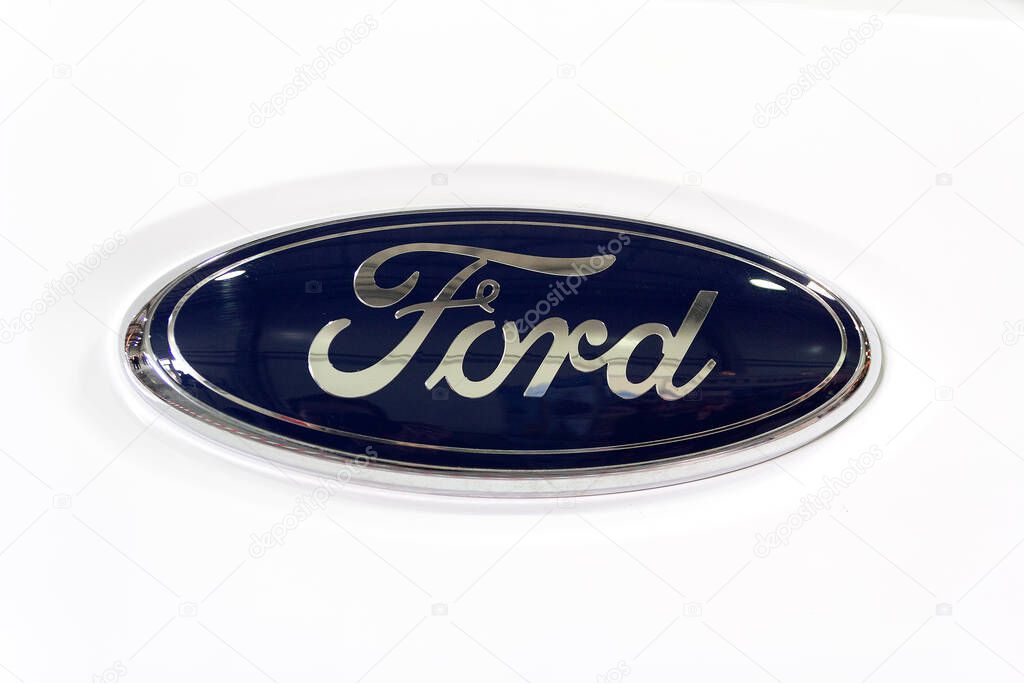 Kyiv, Ukraine - March 20, 2019: Side view of Ford logotype insignia logo on the front part of the radiator