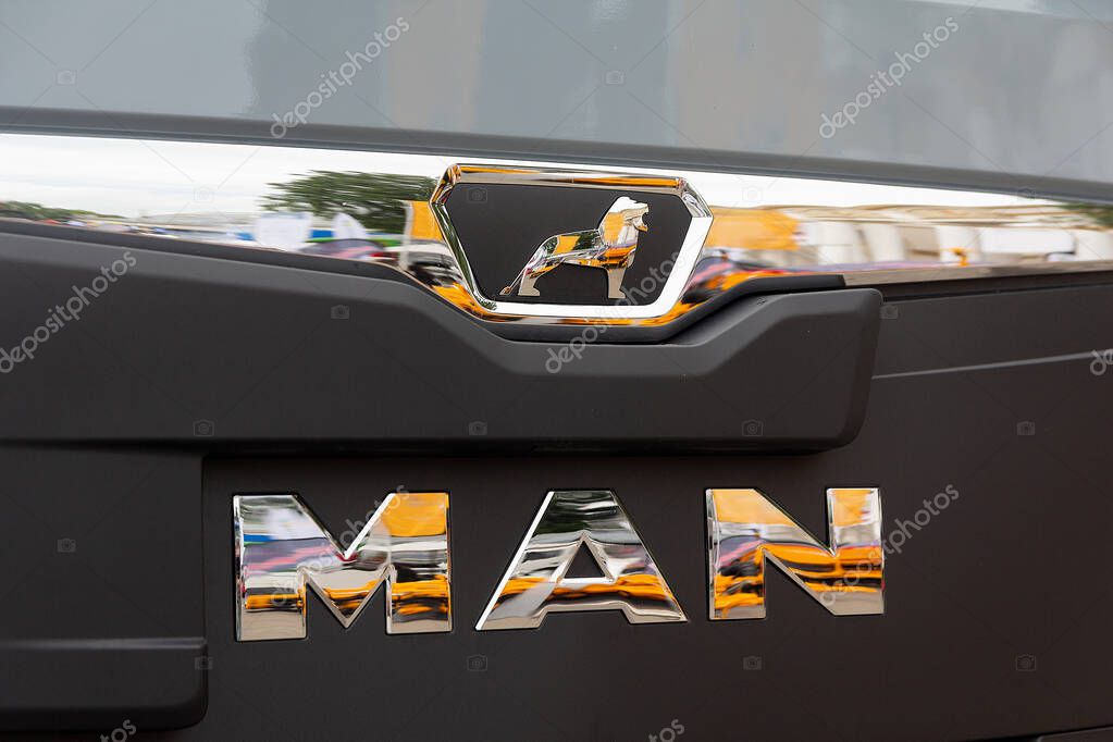 Kyiv, Ukraine - June 11, 2021: Side view of MAN logotype insignia logo on the front part at the industrial exhibition