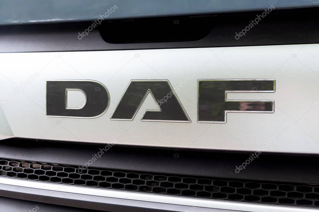 Kyiv, Ukraine - June 11, 2021: Side view of DAF logotype insignia logo on the front part at the industrial exhibition