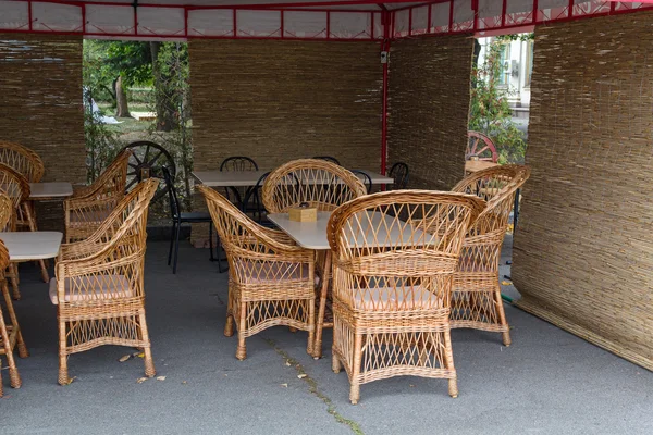 Wicker furniture under the awning — Stock Photo, Image