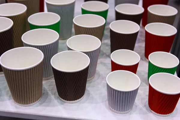 Multicolored empty disposable cups are on the table — Φωτογραφία Αρχείου