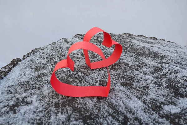 Two red hearts made of paper on a wooden surface. Love — Stock Photo, Image