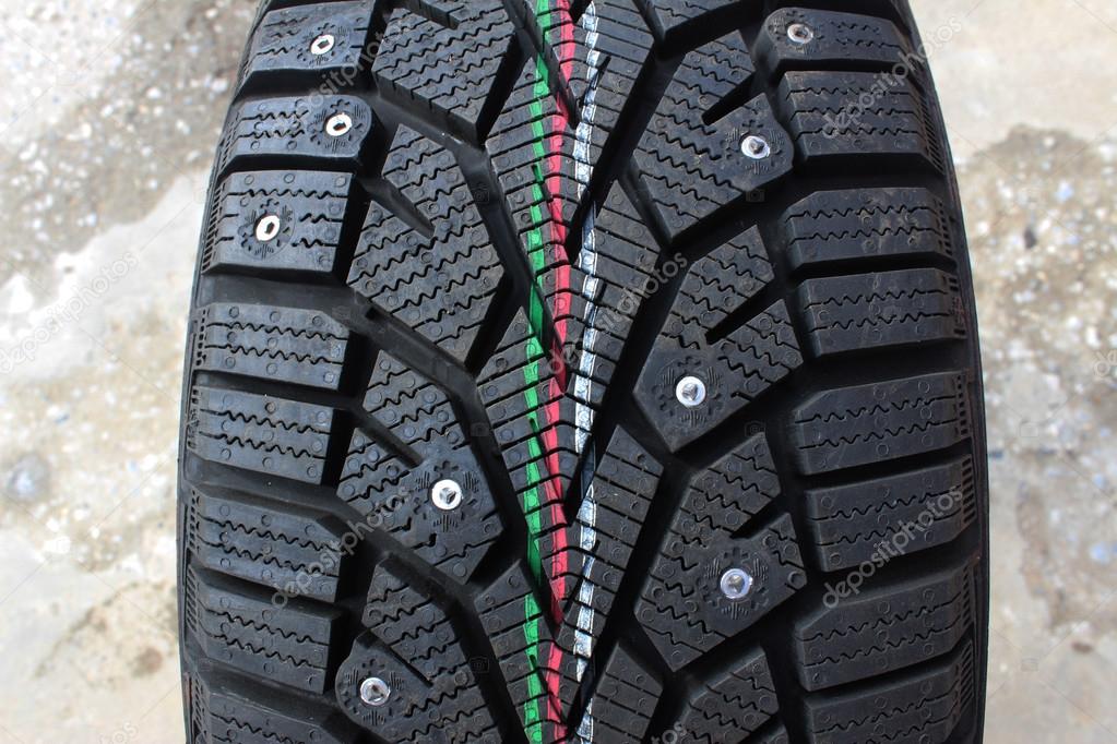 Car winter tyres with spikes — Stock Photo © MG_54 85803608