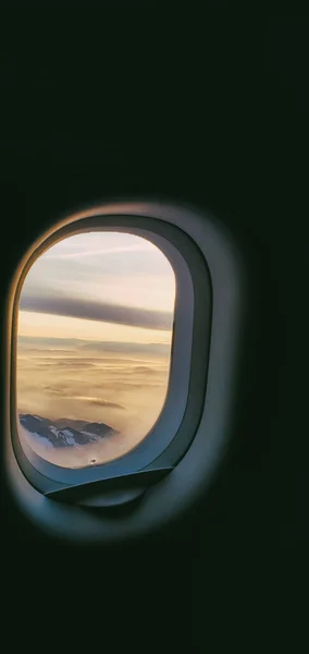 Plane window.  Window porthole in the plane. Window View From Passenger Seat On Commercial Airplane