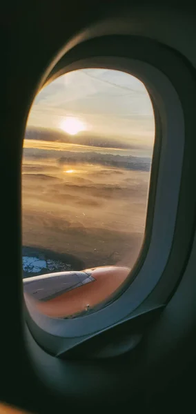 Plane window.  Window porthole in the plane. Window View From Passenger Seat On Commercial Airplane