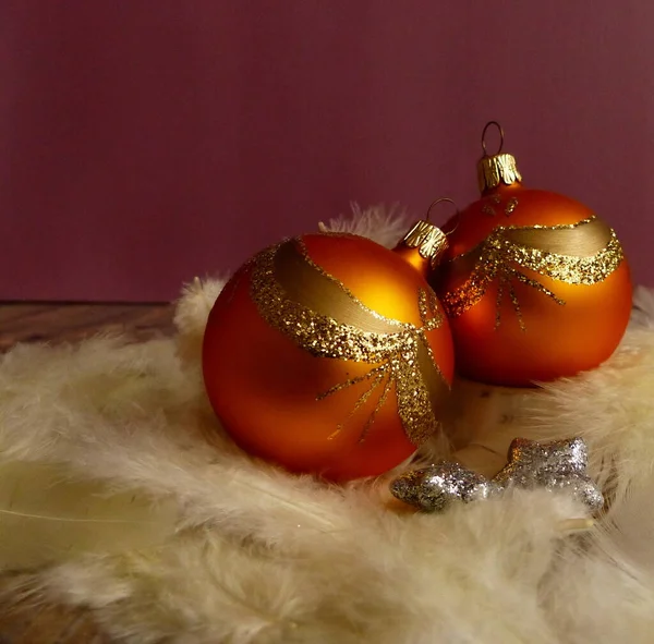 orange christmas ball with gold ornament
