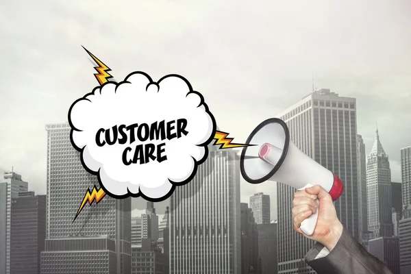 Customer care text on speech bubble and businessman hand holding megaphone — Stock Photo, Image