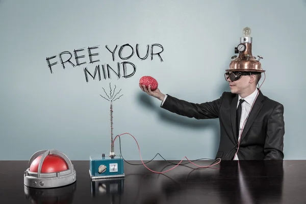 Free your mind concept with businessman holding brain — Stock Photo, Image