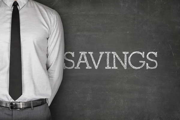 Savings text on blackboard — Stock Photo, Image