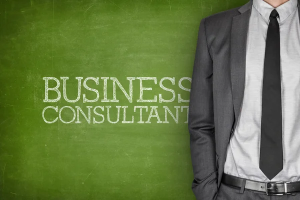 Business consultant on blackboard — Stock Photo, Image
