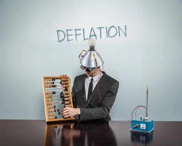 Deflation concept with businessman — Stock Photo, Image